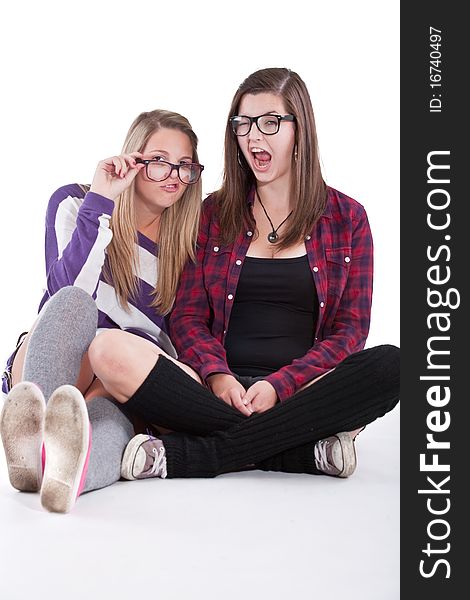 Young trendy teenagers in a nerd / geek style. Isolated over white background.