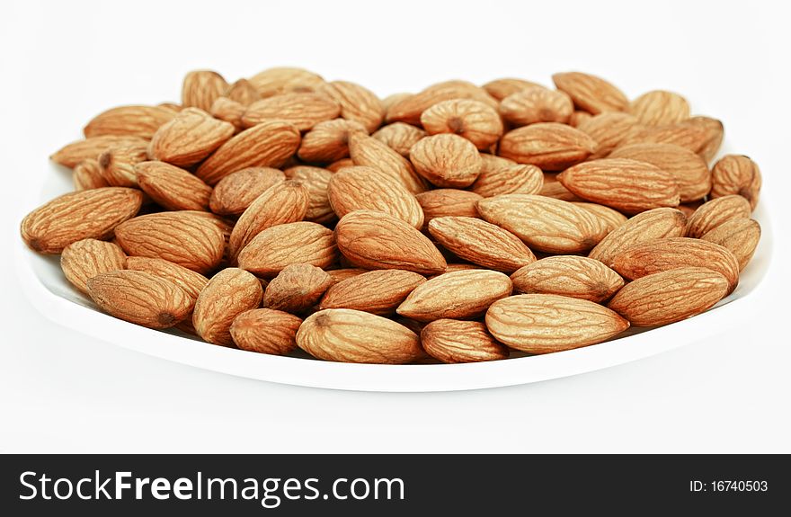 Ripe almonds on white background