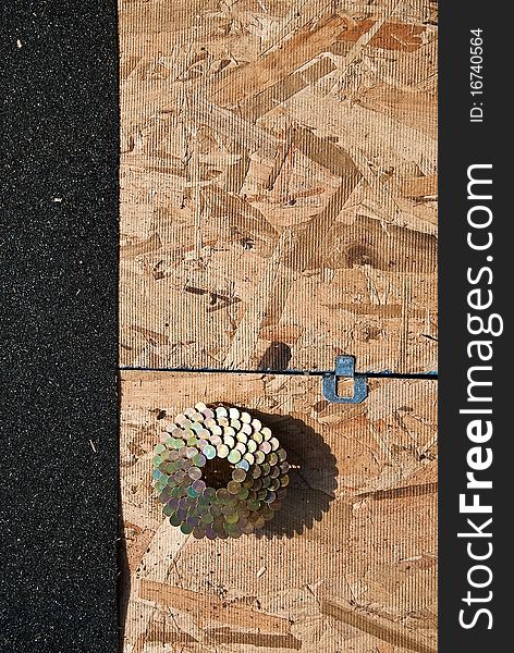 Looking at the top of an unfinished roof as coiled nails sit in wait for use. Looking at the top of an unfinished roof as coiled nails sit in wait for use.