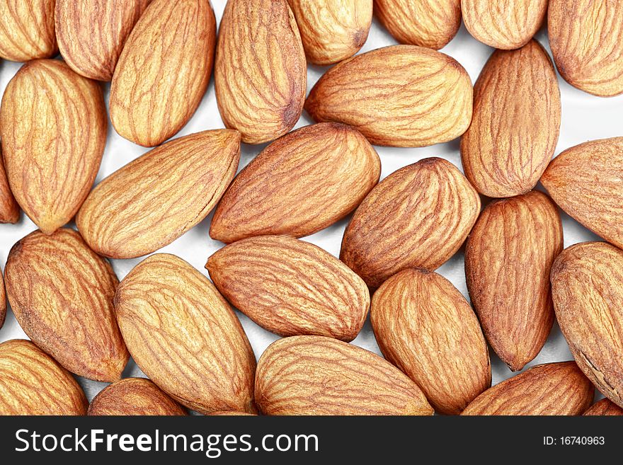 Ripe almonds on white background
