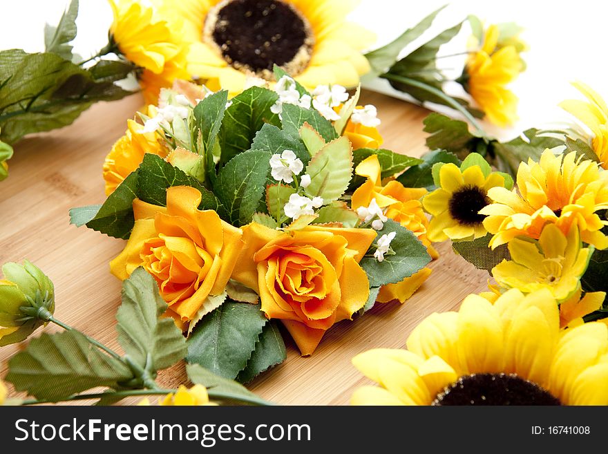 Bunch of flowers with sunflowers on wood board