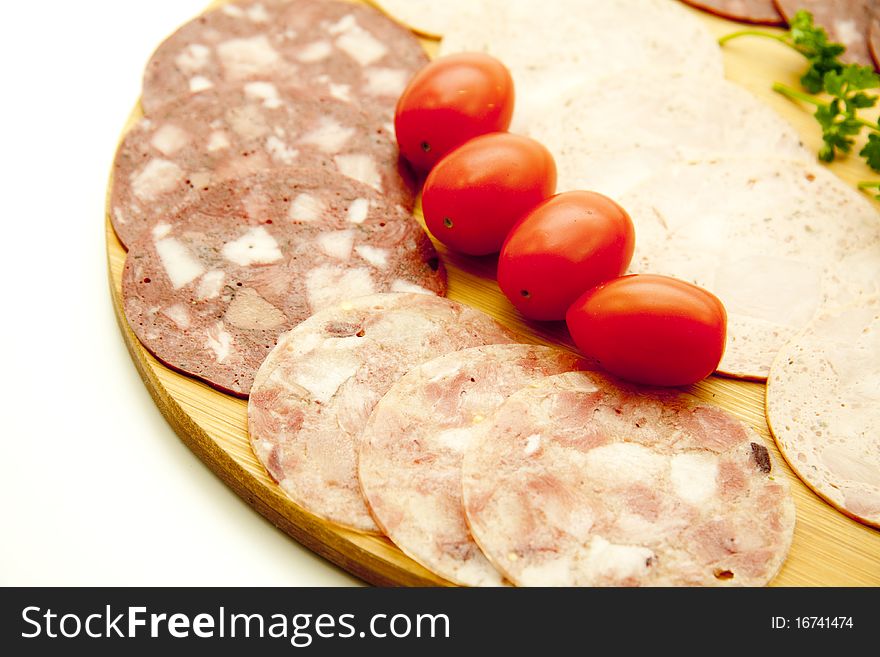 Sausage plate with cherry tomatoes and parsley
