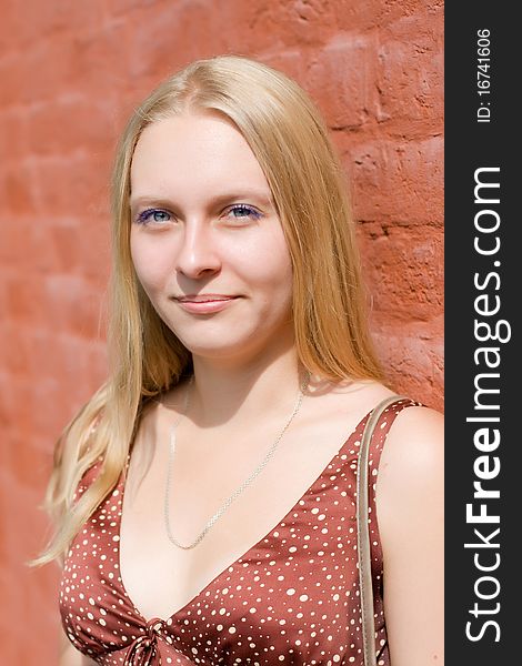 Summer portrait of the beautiful fair-haired girl