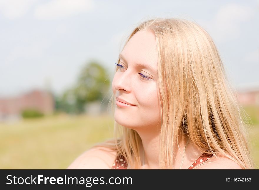 Summer portrait of the beautiful fair-haired girl