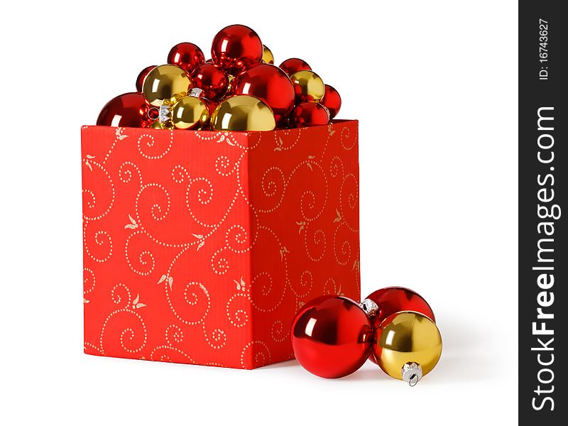 Christmas present. Gift box and christmas baubles on a white background. Christmas present. Gift box and christmas baubles on a white background