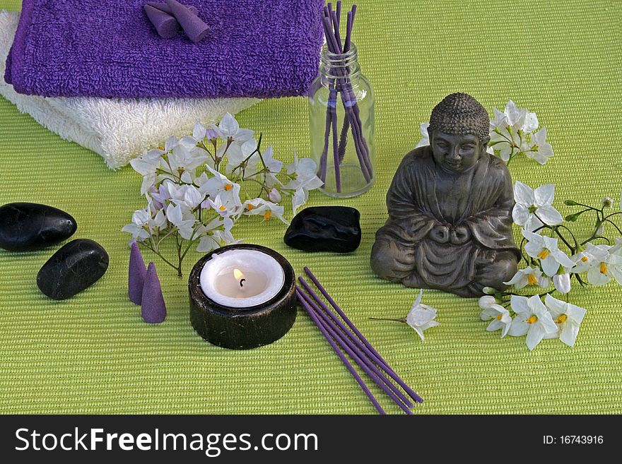 Buddha with jasmine flowers and incense