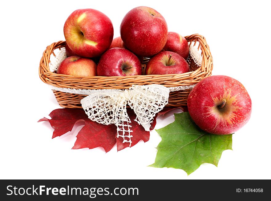 Amazing basket full of autumn fruits isolated on a white background. Amazing basket full of autumn fruits isolated on a white background.