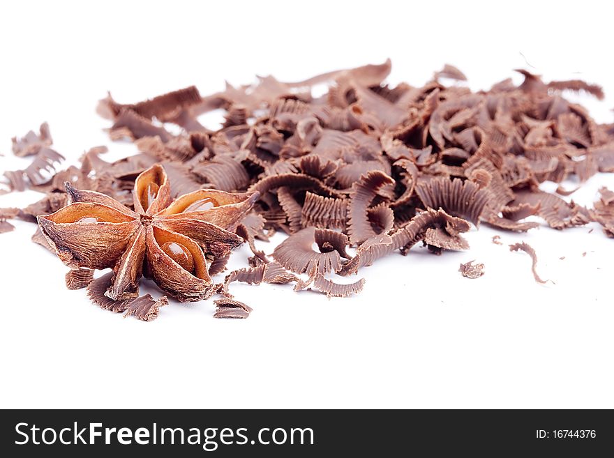 Bitter chocolate in a small crumb on a white background.