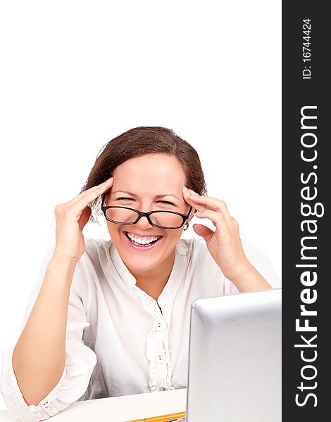 Happy businesswoman in glasses in office, working with laptop