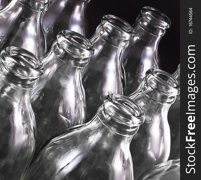 Empty bottles collection, colorless, isolated on black background