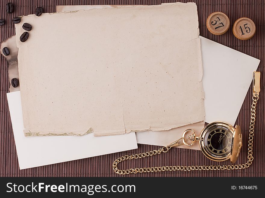 Old tattered sheets of paper on brown wood background for design creativity.