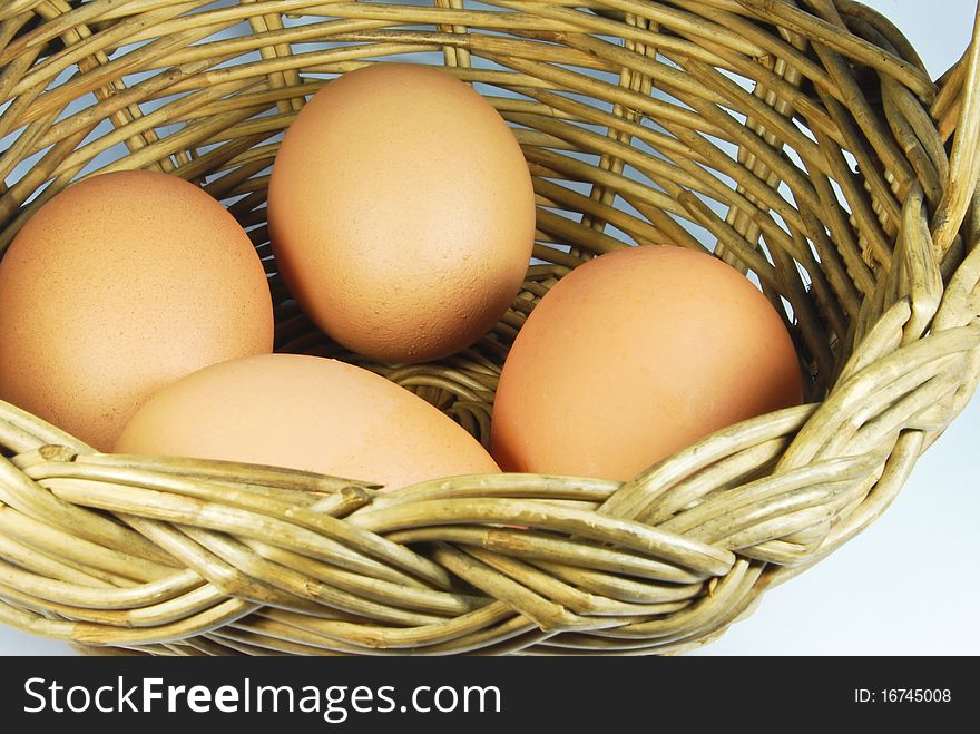 Many of fresh eggs in vintage style basket. Many of fresh eggs in vintage style basket