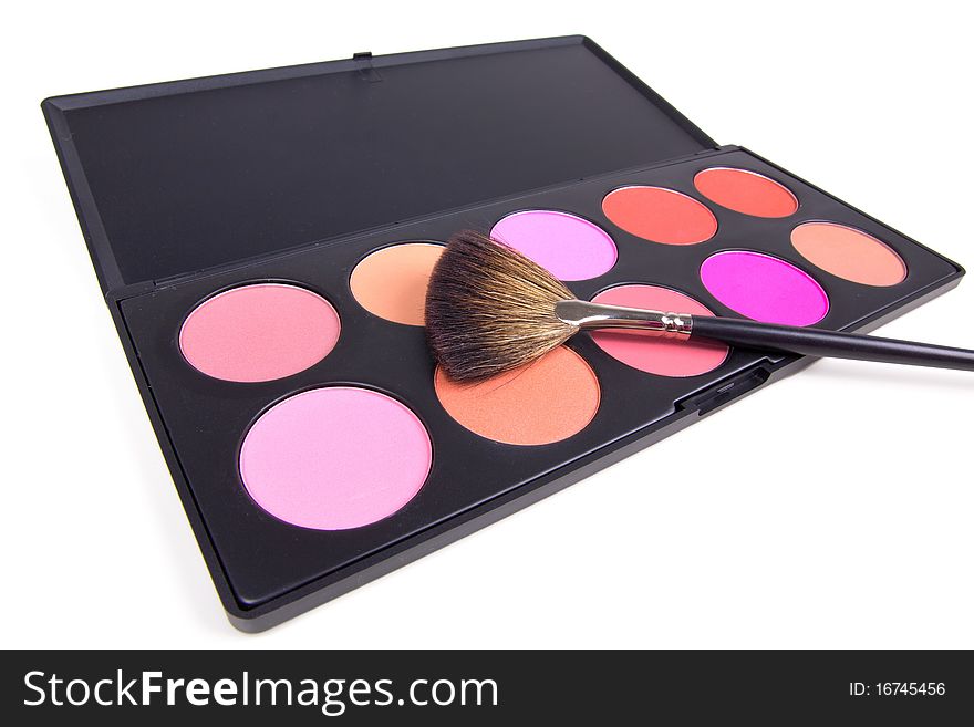 Professional make-up brush on eyeshadows palette, closed-up