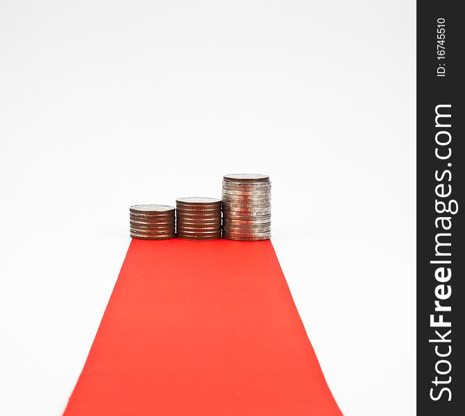 Red carpet and column of coin isolated on white background. Red carpet and column of coin isolated on white background