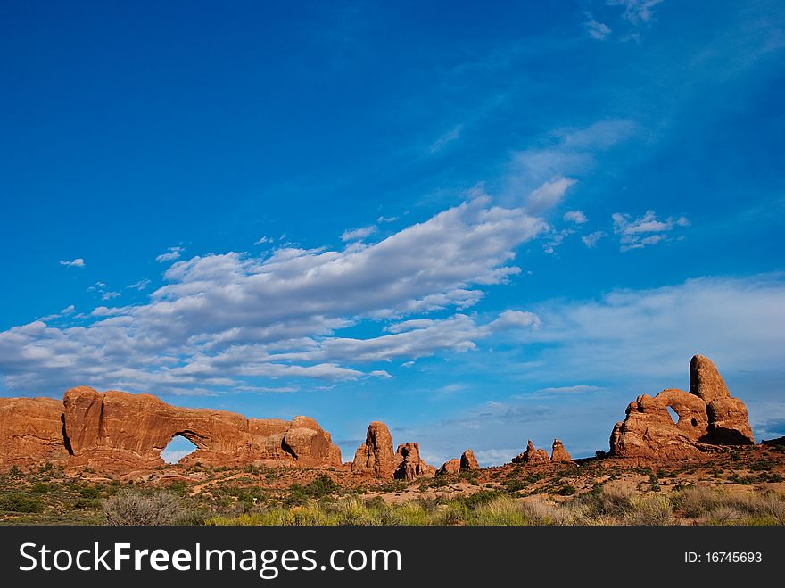 Picturesque clouds over Windows section of Arches National Park near Moab, Utah. Picturesque clouds over Windows section of Arches National Park near Moab, Utah