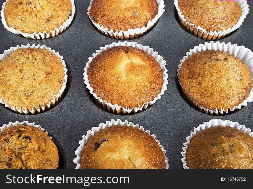 Muffins still in the pan - fresh and ready to be eaten