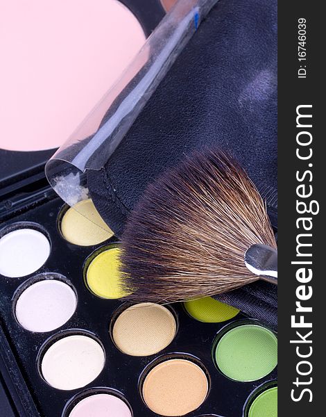 Make-up brush on multicolour eyeshadows palette