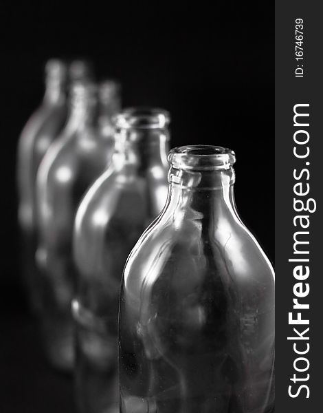 Empty bottles collection, colorless, isolated on black background