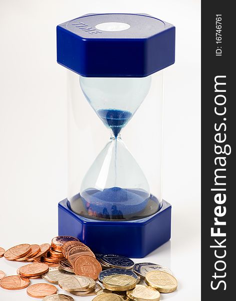 A vertical image of a hourglass and money,signify time is money concept