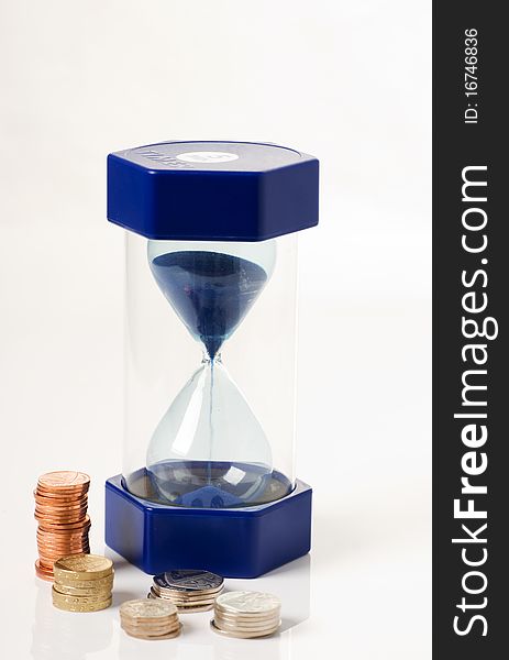 A vertical image of a hourglass and money,signify time is money concept