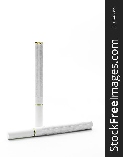 A pair of two white cigarettes with white filters on white background.