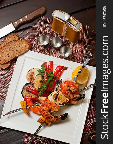 Grilled prawns with vegetables on the plate