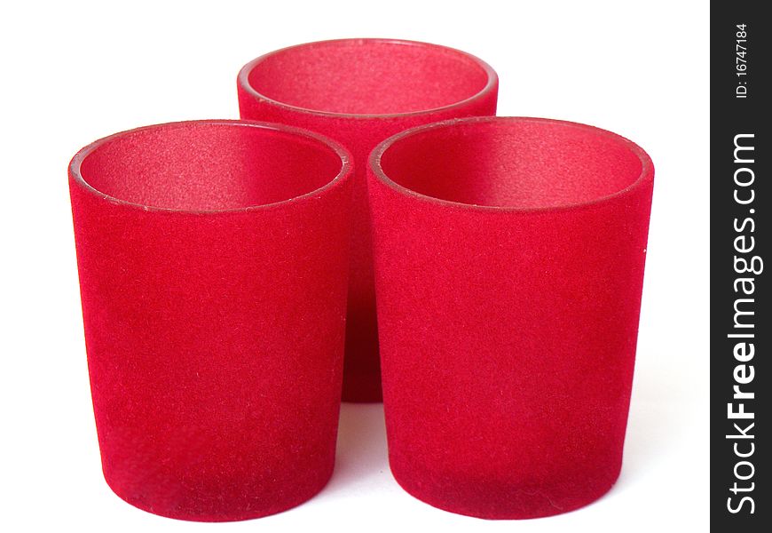 Three red glass pot holders isolated on white background