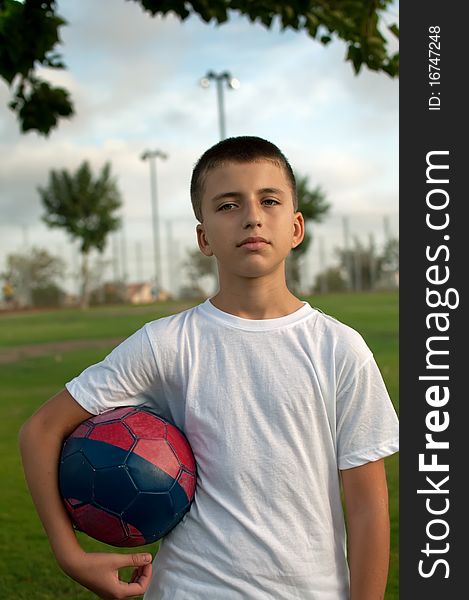 Young boy with soccer ball . Young boy with soccer ball .