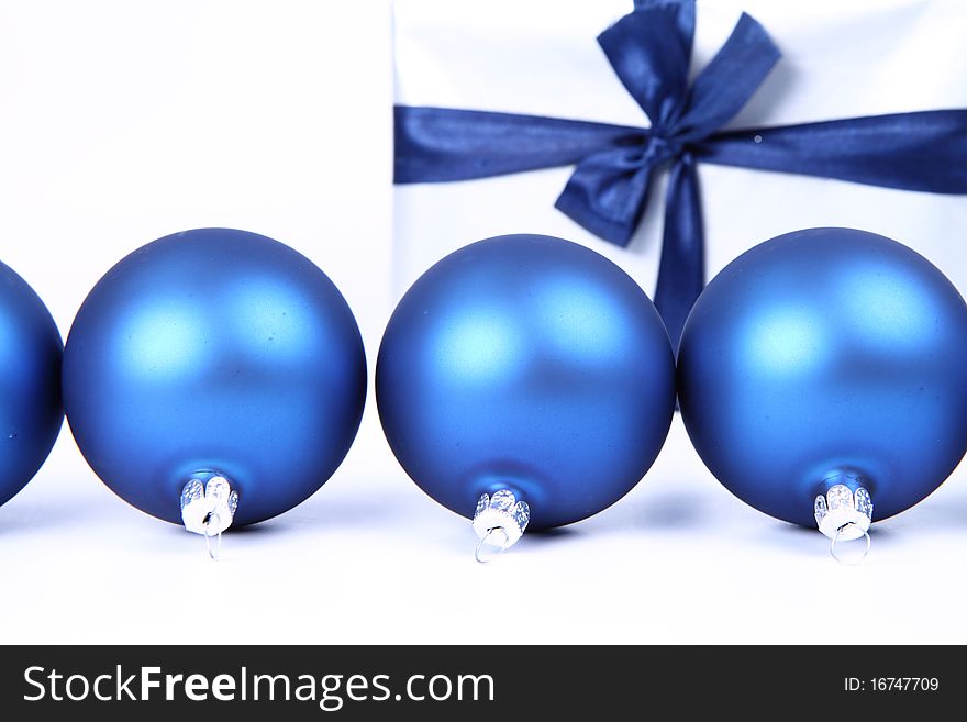 Christmas Balls And A Gift Background