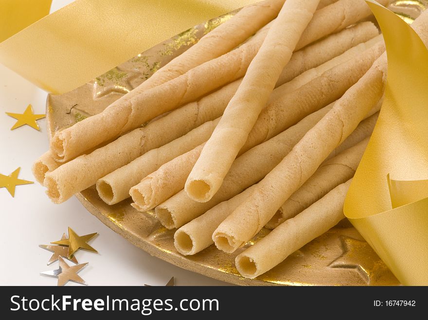 Traditional Spanish wafer rolls for Christmas named neules or barquillos. Traditional Spanish wafer rolls for Christmas named neules or barquillos.