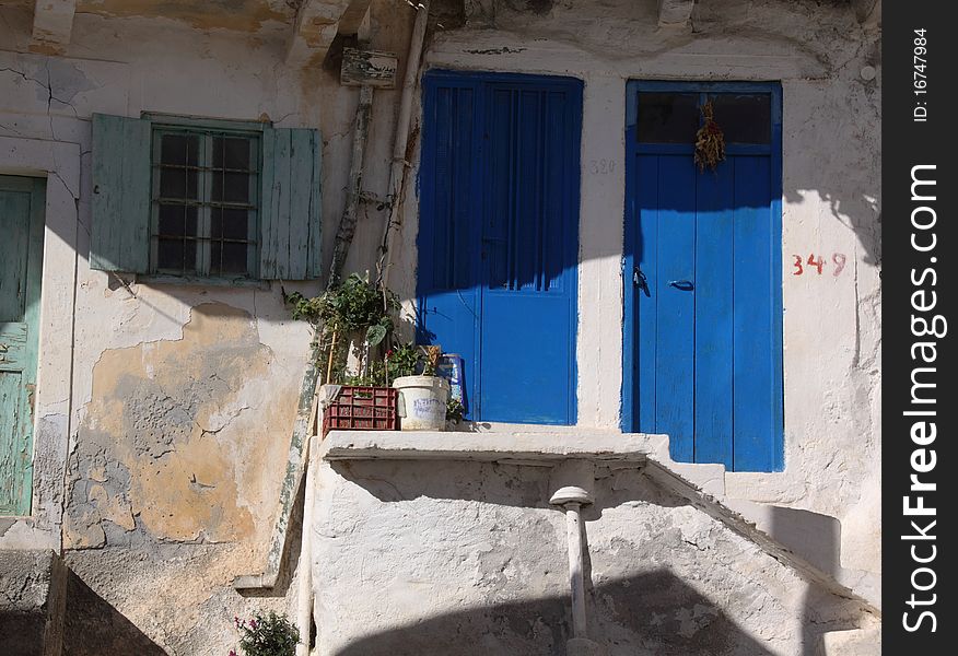 Two blue doors in a little village on the island Crete