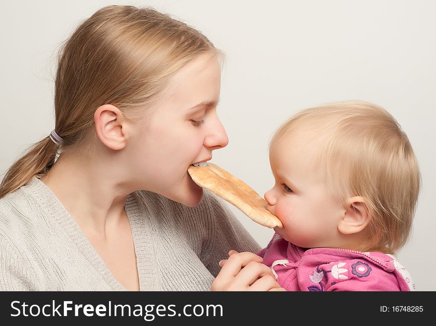 Mother with daughter eat flatbread