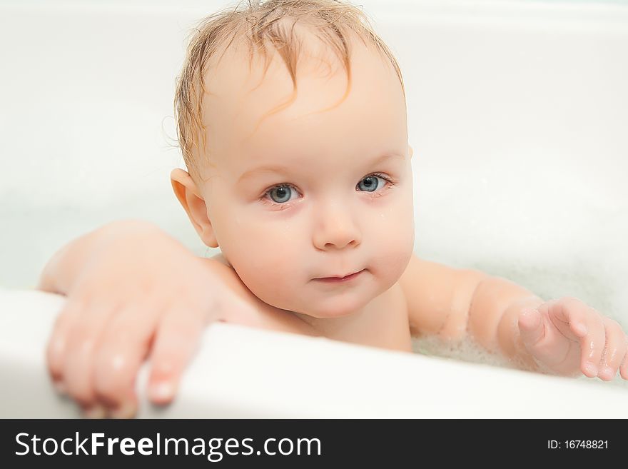 Cute Adorable Baby Sit In Water In Foam Bath