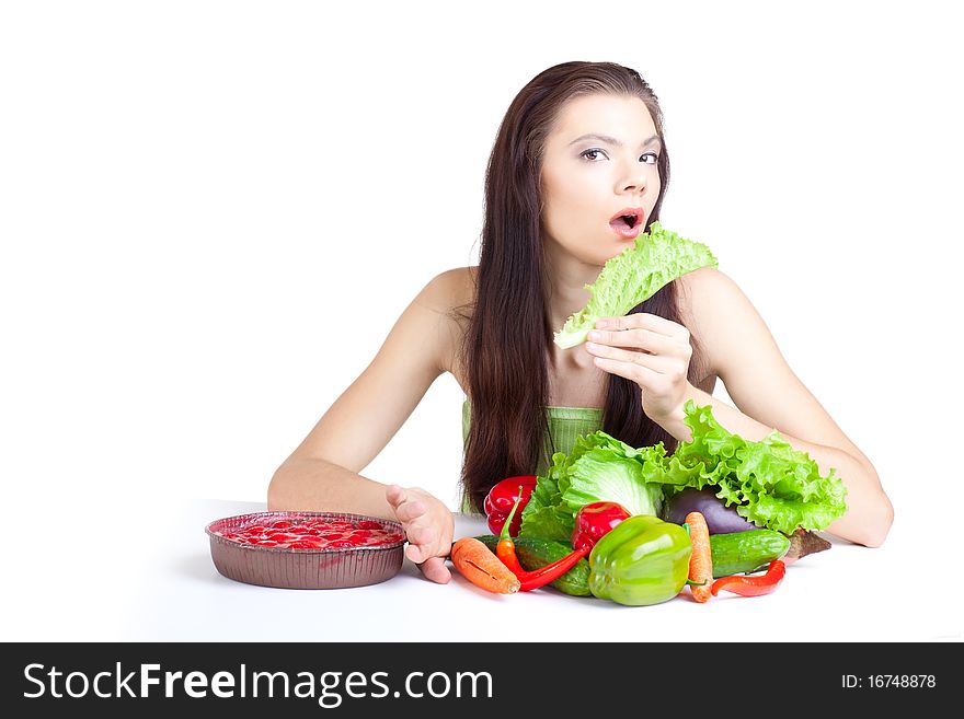 Young girl with  vegetables over white background