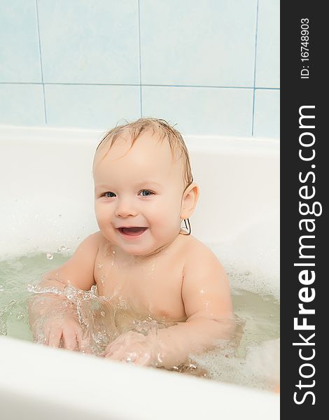 Cute Adorable Baby Clapping On Water In Foam Bath