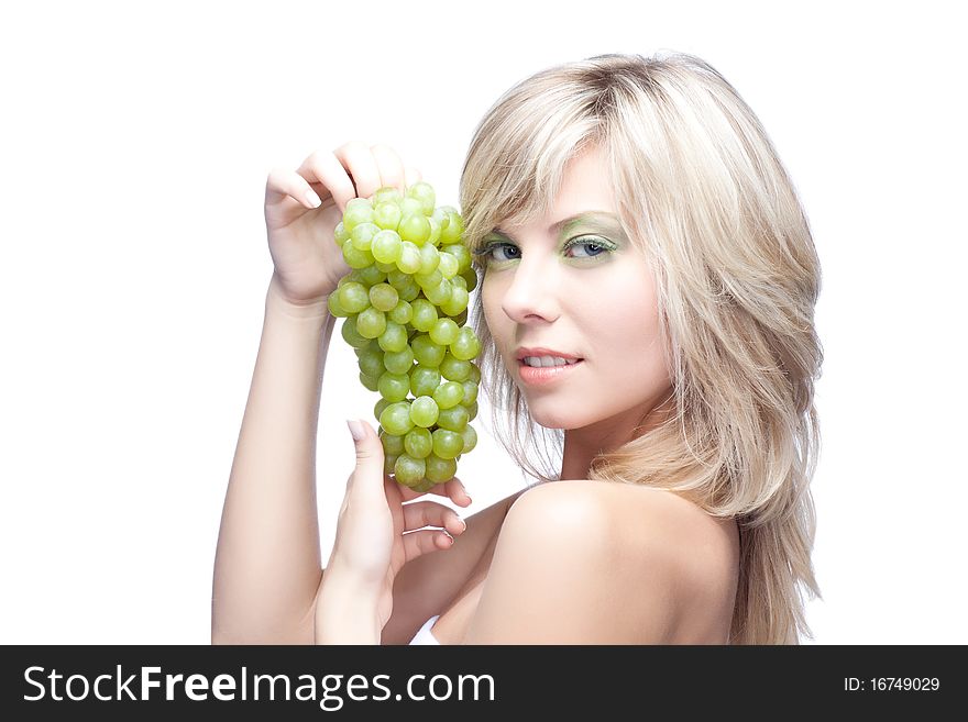 Beautiful woman over white background with grape. Beautiful woman over white background with grape