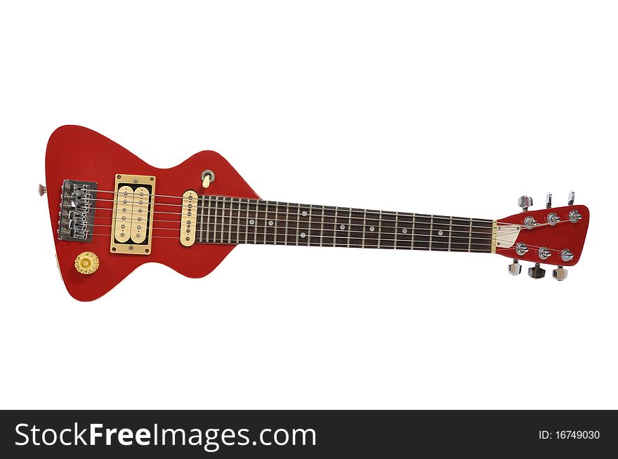 A grungy red travel electric guitar. A grungy red travel electric guitar