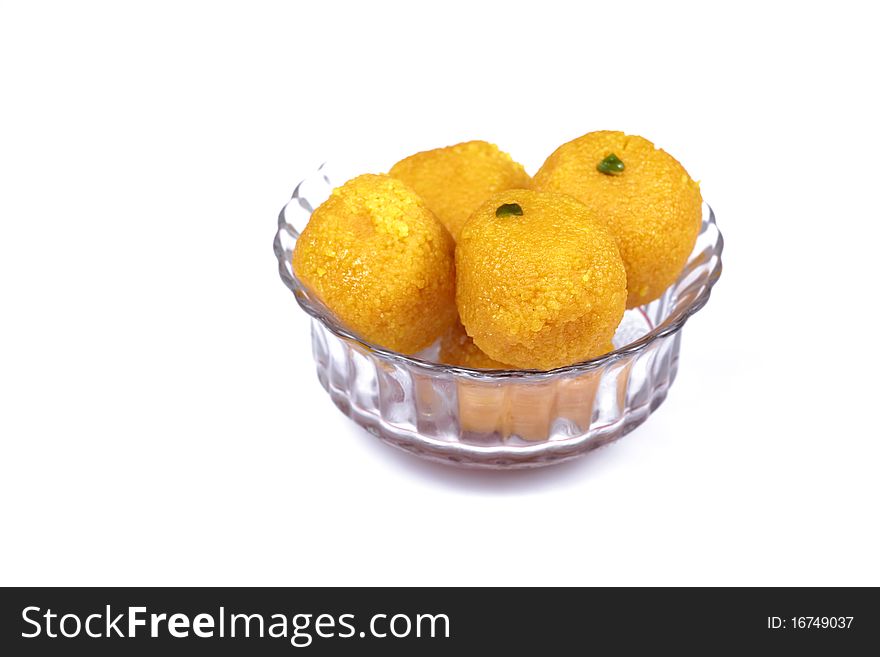 Indian sweet laddoo in glass bowl.