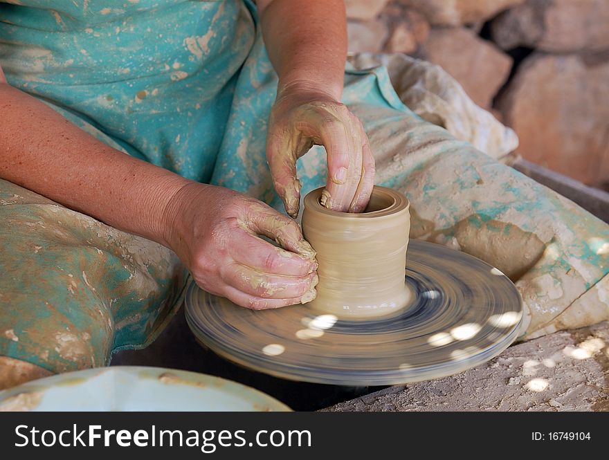 Close up of the hands of a potter