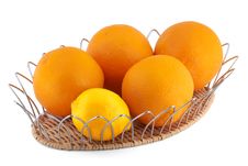 Oranges And A Lemon In A Fruits Basket Royalty Free Stock Photography Oranges And A Lemon In A Fruits Basket Royalty Free Stock Photography
