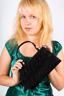 Young Woman With Clutch Bag Stock Photo