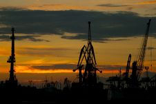 Silhouettes Of Cranes In The Port Stock Images Silhouettes Of Cranes In The Port Stock Images