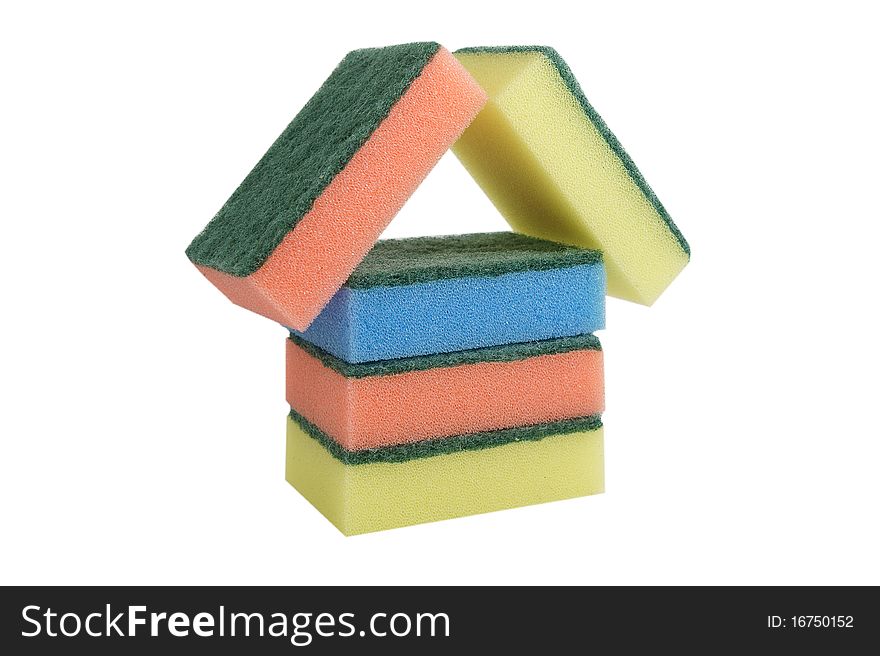 Kitchen sponges in the form of a small house of red, yellow, dark blue color on a white background. Kitchen sponges in the form of a small house of red, yellow, dark blue color on a white background
