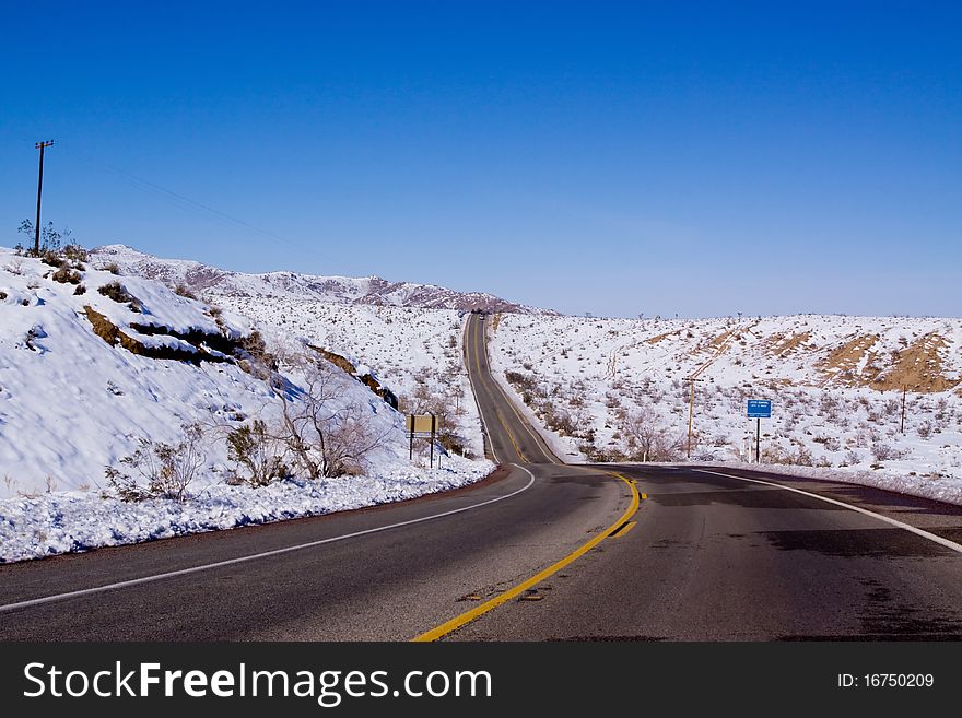 Desert road in snowy desert