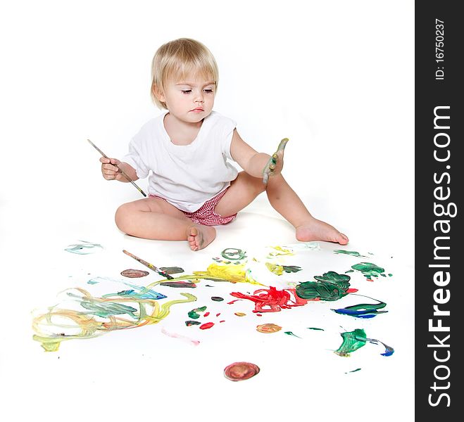 Cute child painting over white