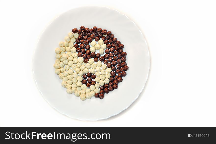 black and white chocolate balls in dish. yin-jan