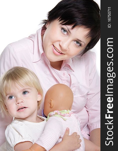 Studio portrait of young attractive mother and daughter over white