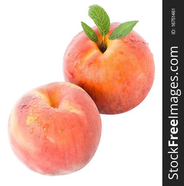 Close-up peaches with leaves, isolated on white