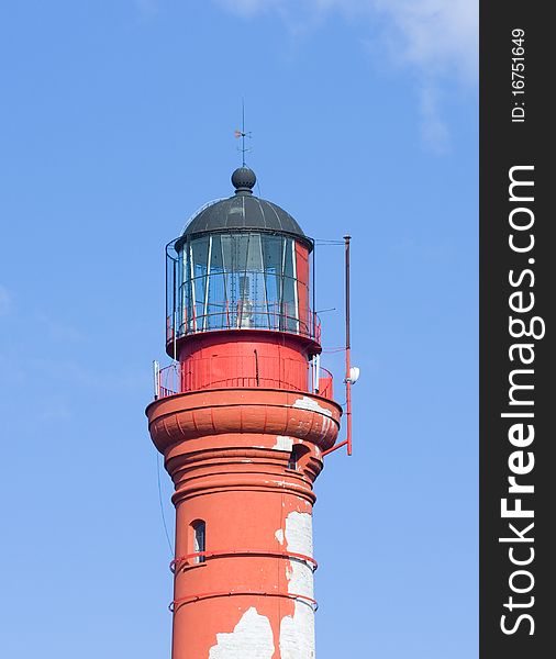 Old lighthouse over blue sky