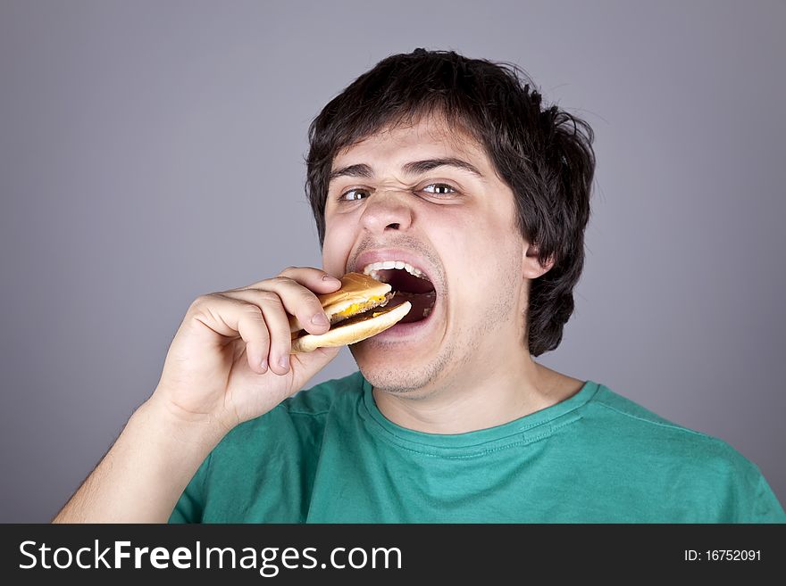 Cute Boy Eating Hamburger.
